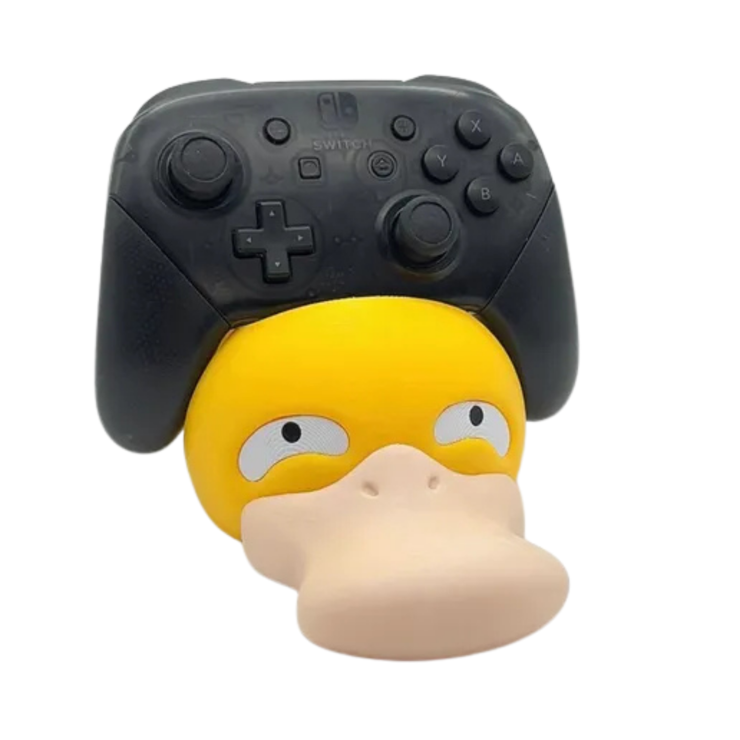 Porta mando Psyduck de Pokémon con un control de Nintendo Switch Pro negro, visto de frente, destacando la expresión confundida de Psyduck.