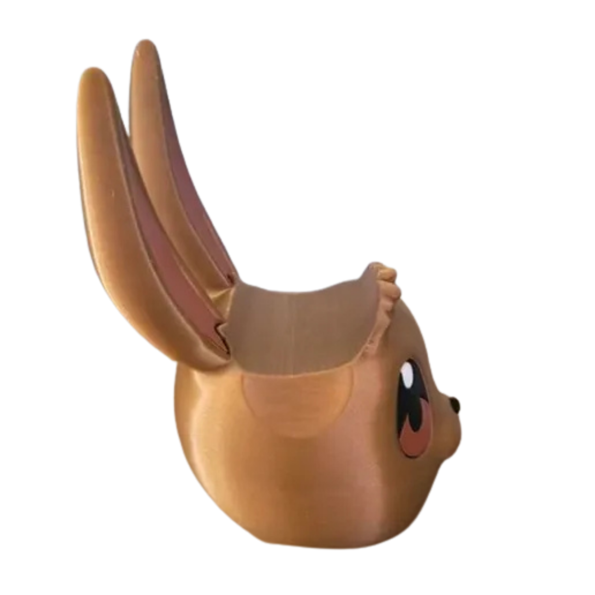 Base para mando con diseño de la cabeza de Eevee (Pokémon) en marrón, vista lateral/trasera, mostrando el espacio para el controlador.